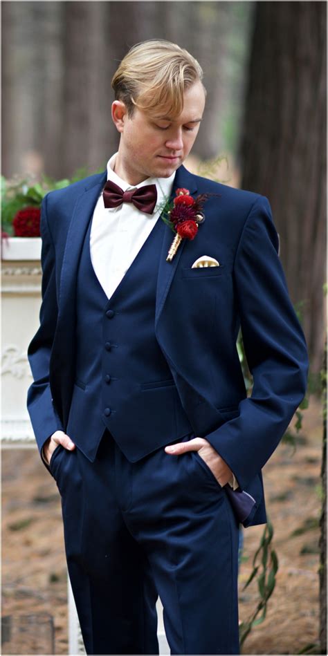 burgundy bow tie navy suit.